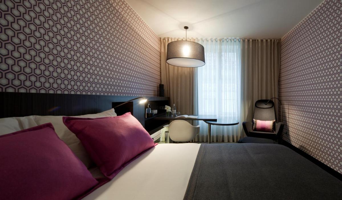 Uma cama ou camas num quarto em Inspira Liberdade Boutique Hotel