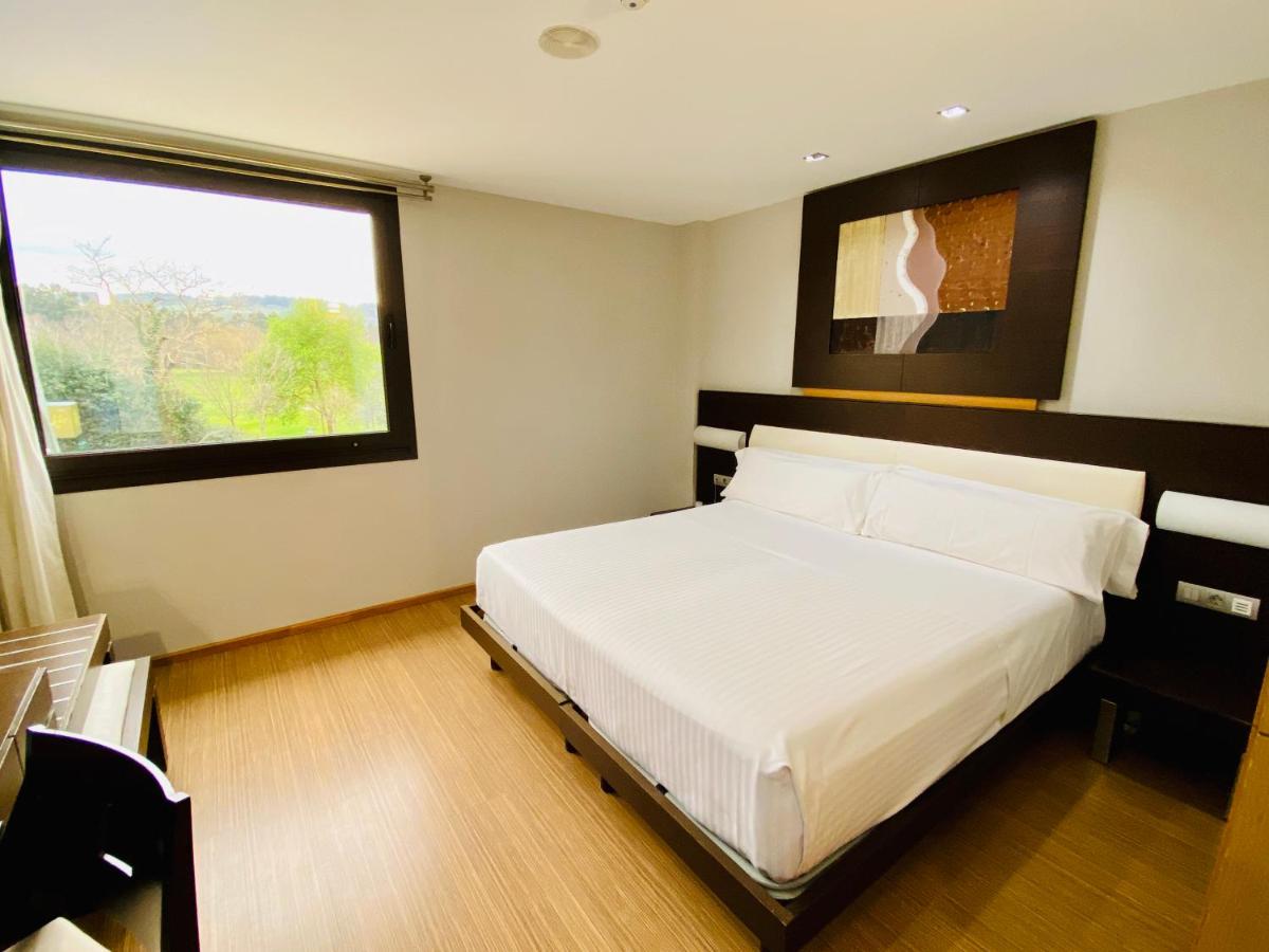 Cama o camas de una habitación en Oca Palacio De La Llorea Hotel & Spa