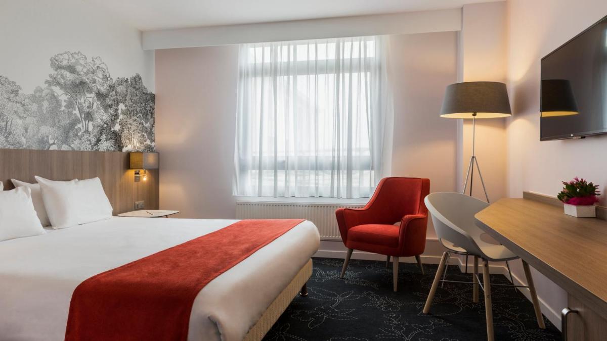Un ou plusieurs lits dans un hébergement de l'établissement Holiday Inn Calais Coquelles by IHG