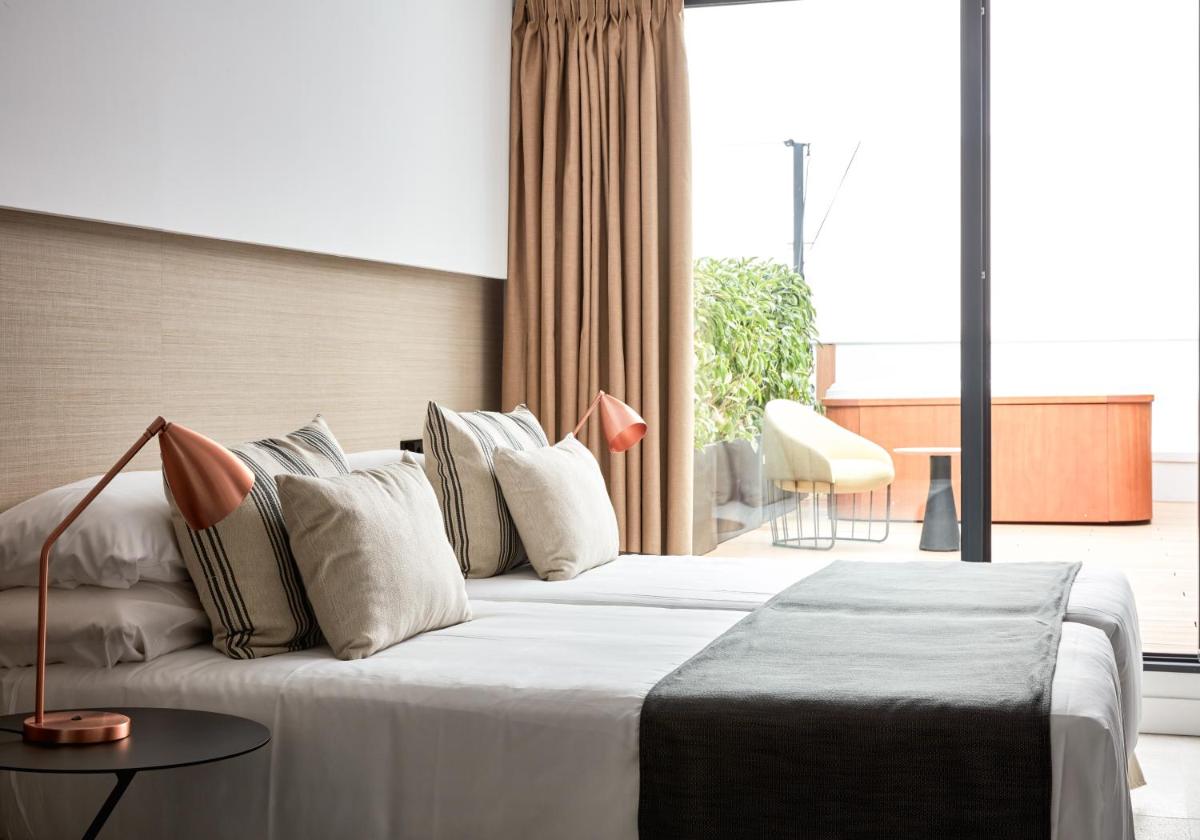 Cama o camas de una habitación en Nakar Hotel
