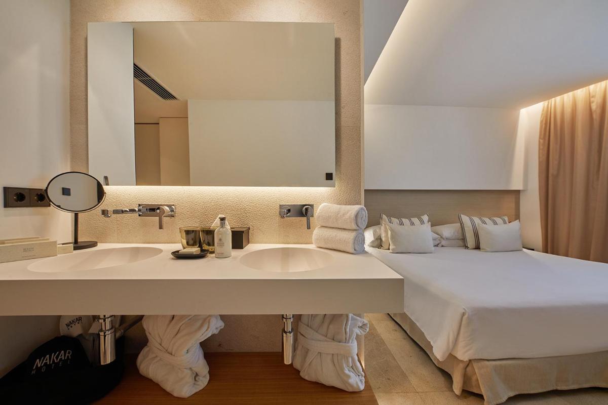 Cama o camas de una habitación en Nakar Hotel