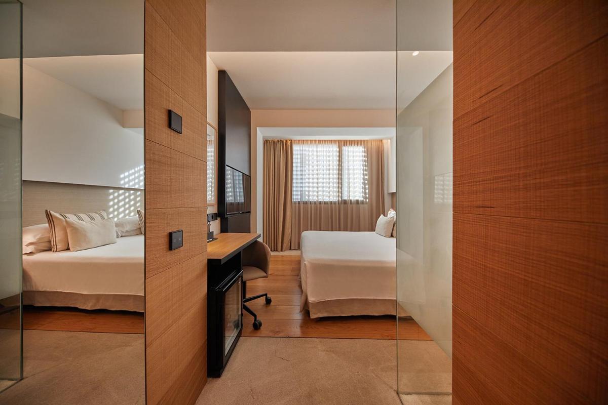 Cama o camas de una habitación en Nakar Hotel