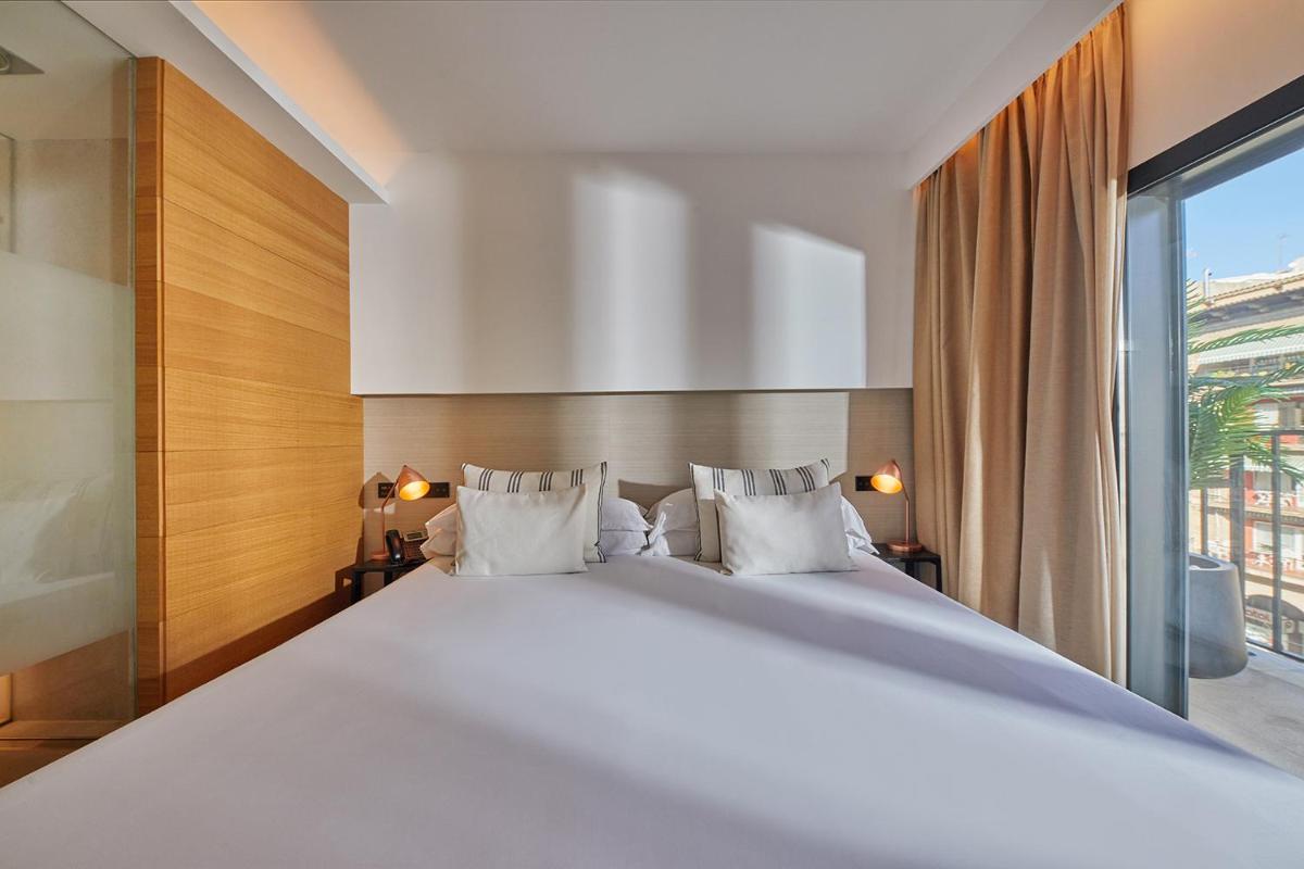 Cama o camas de una habitación en Nakar Hotel