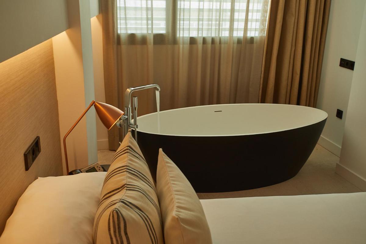 Cama o camas de una habitación en Nakar Hotel