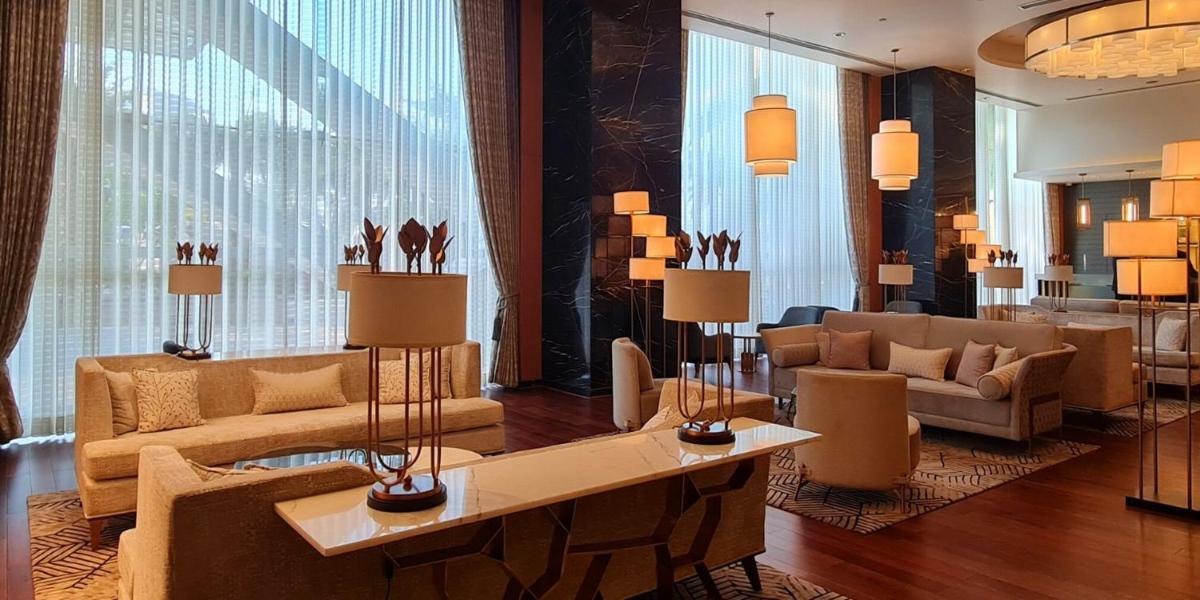 a lobby with couches and a table with lamps at InterContinental Jaipur Tonk Road by IHG in Jaipur