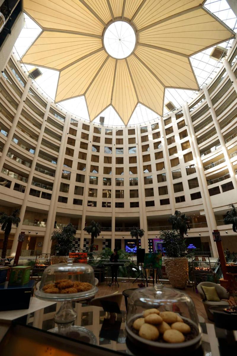 a large building with a large clock on the ceiling at Radisson Blu Hotel New Delhi Dwarka in New Delhi a large building with a large clock on the ceiling at Radisson Blu Hotel New Delhi Dwarka in New Delhi