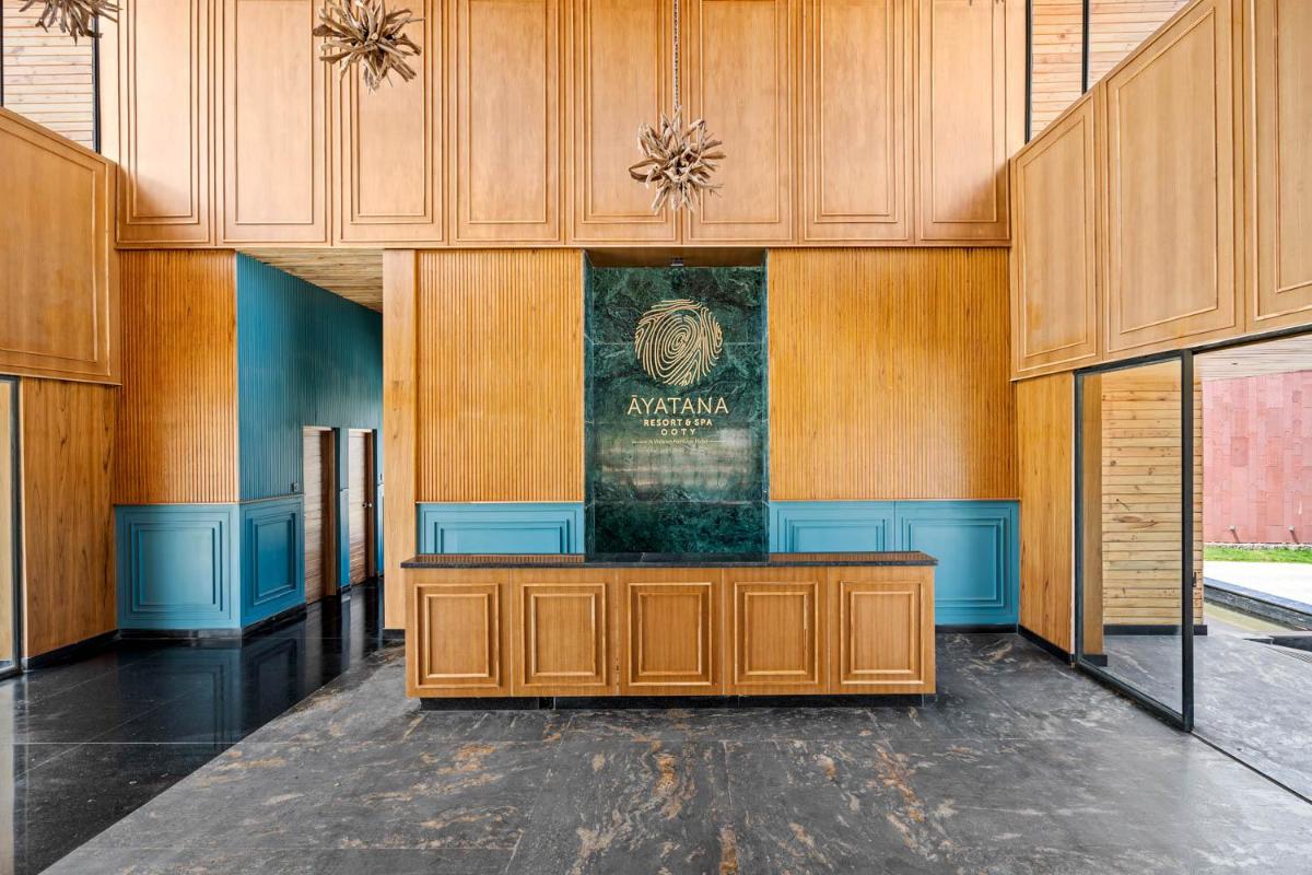 a court room with a sign on the wall at WelcomHeritage Ayatana Ooty in Ooty