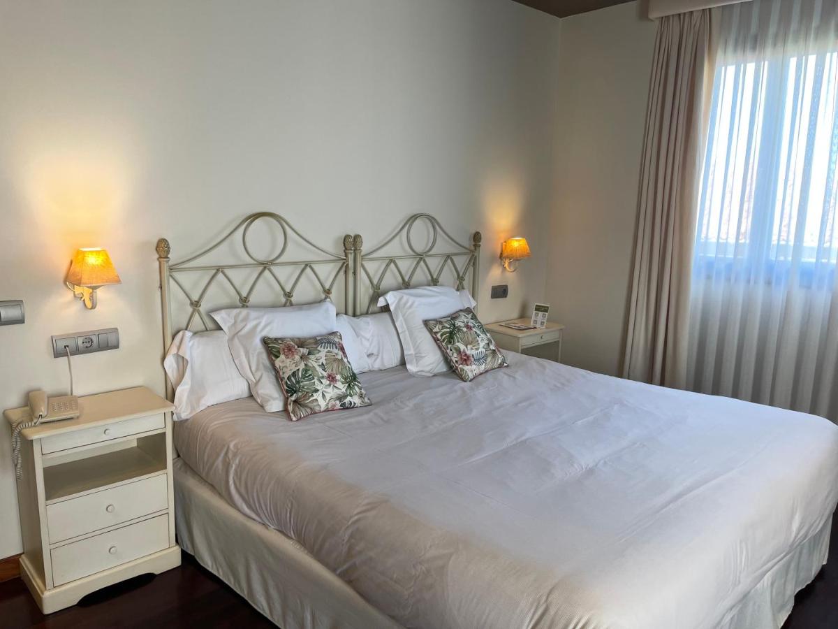 Cama o camas de una habitación en Hosteria de Torazo Nature Hotel & Spa