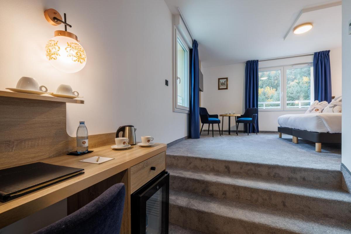 Un ou plusieurs lits dans un hébergement de l'établissement Hotel SPA Husseren Collections - Proche Colmar - Eguisheim