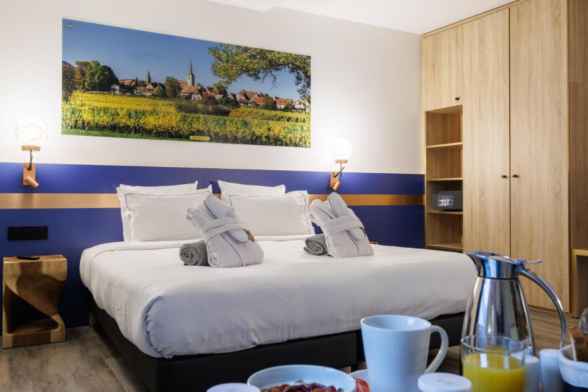 Un ou plusieurs lits dans un hébergement de l'établissement Hotel SPA Husseren Collections - Proche Colmar - Eguisheim