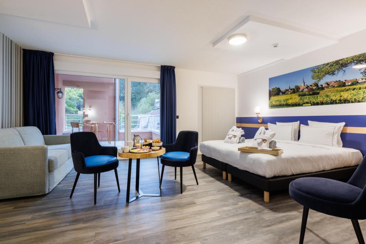 Coin salon dans l'établissement Hotel SPA Husseren Collections - Proche Colmar - Eguisheim