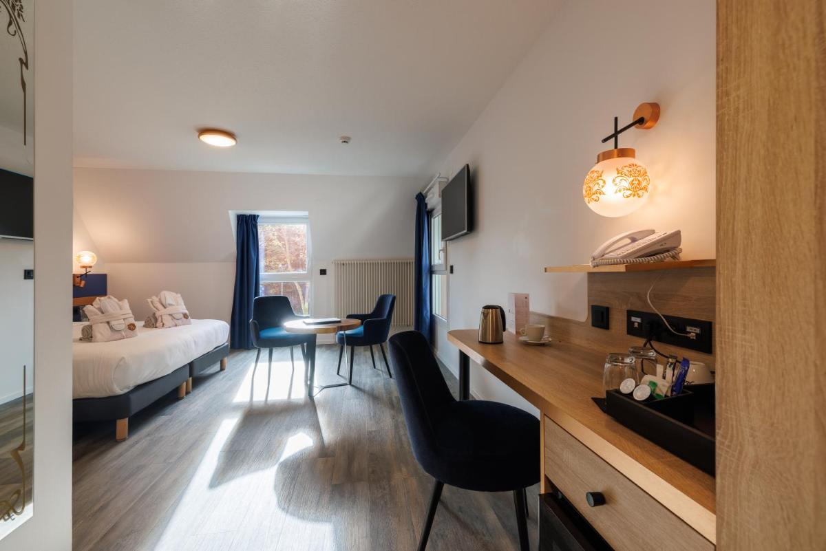 Un ou plusieurs lits dans un hébergement de l'établissement Hotel SPA Husseren Collections - Proche Colmar - Eguisheim