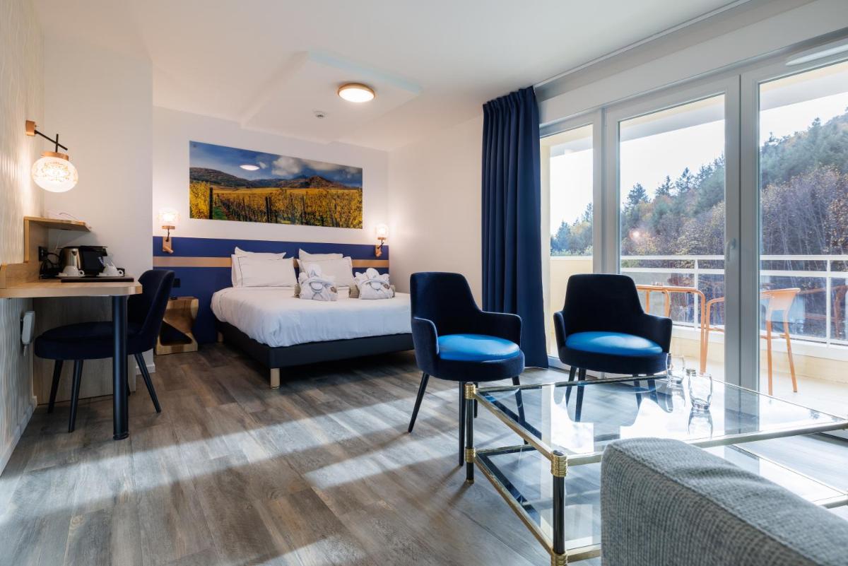 Un ou plusieurs lits dans un hébergement de l'établissement Hotel SPA Husseren Collections - Proche Colmar - Eguisheim