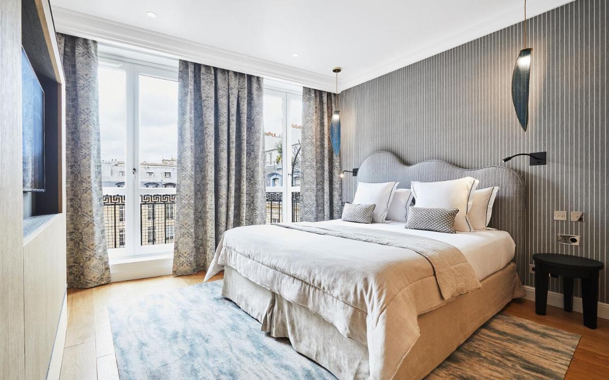Un ou plusieurs lits dans un hébergement de l'établissement Grand Hôtel Du Palais Royal