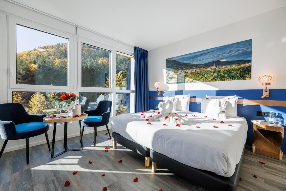 Un ou plusieurs lits dans un hébergement de l'établissement Hotel SPA Husseren Collections - Proche Colmar - Eguisheim