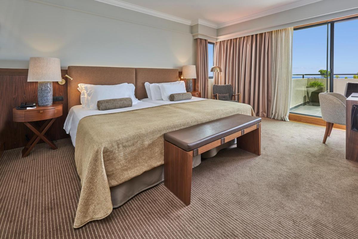 Uma cama ou camas num quarto em The Cliff Bay - PortoBay