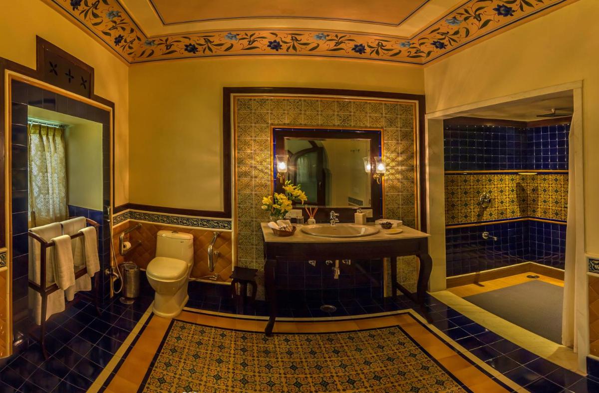 a bathroom with a toilet and a sink and a tub at Royal Heritage Haveli - By Leisure Hotels in Jaipur