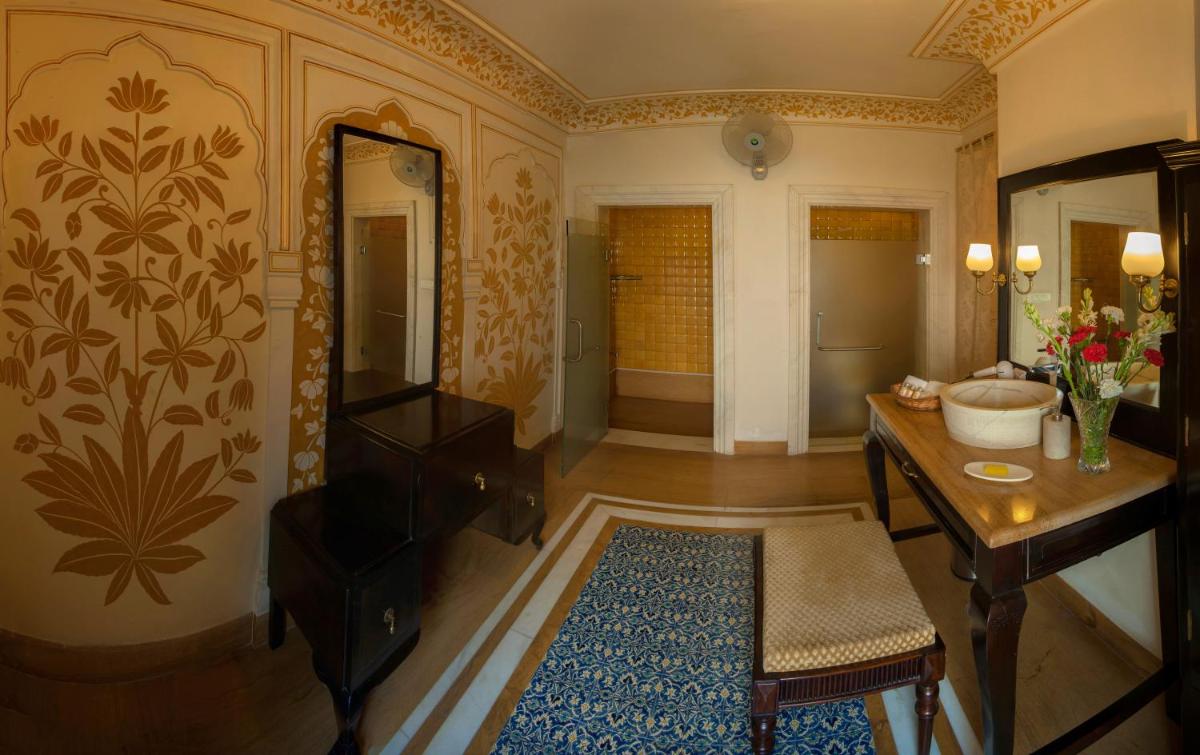 a bathroom with a vanity and a sink and a mirror at Royal Heritage Haveli - By Leisure Hotels in Jaipur