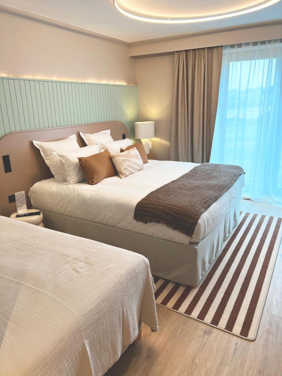 Un ou plusieurs lits dans un hébergement de l'établissement Emeria Dinard Thalasso Spa