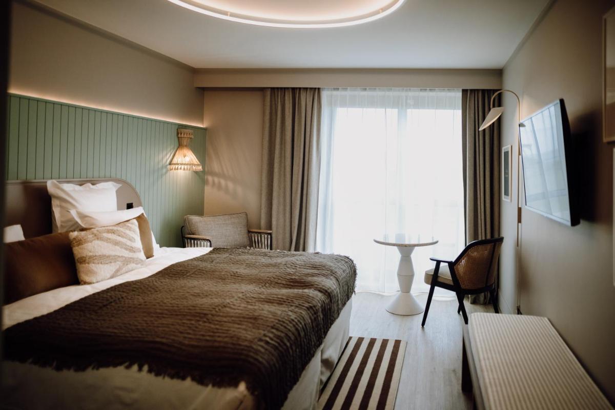 Un ou plusieurs lits dans un hébergement de l'établissement Emeria Dinard Thalasso Spa
