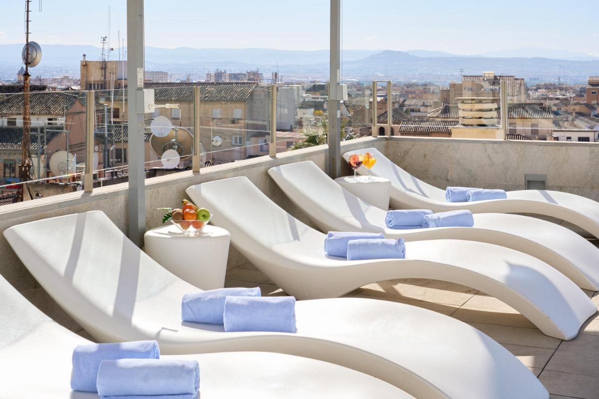 Zona de estar de Hotel Maciá Granada Five Senses Rooms & Suites
