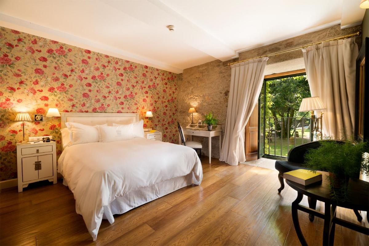Cama o camas de una habitación en A Quinta Da Auga Hotel Spa Relais & Chateaux
