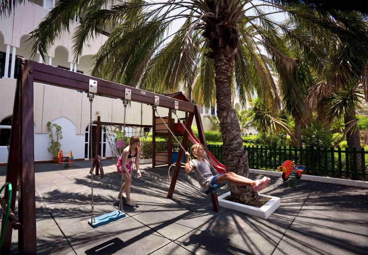 Zona de juegos infantil en Seaside Sandy Beach