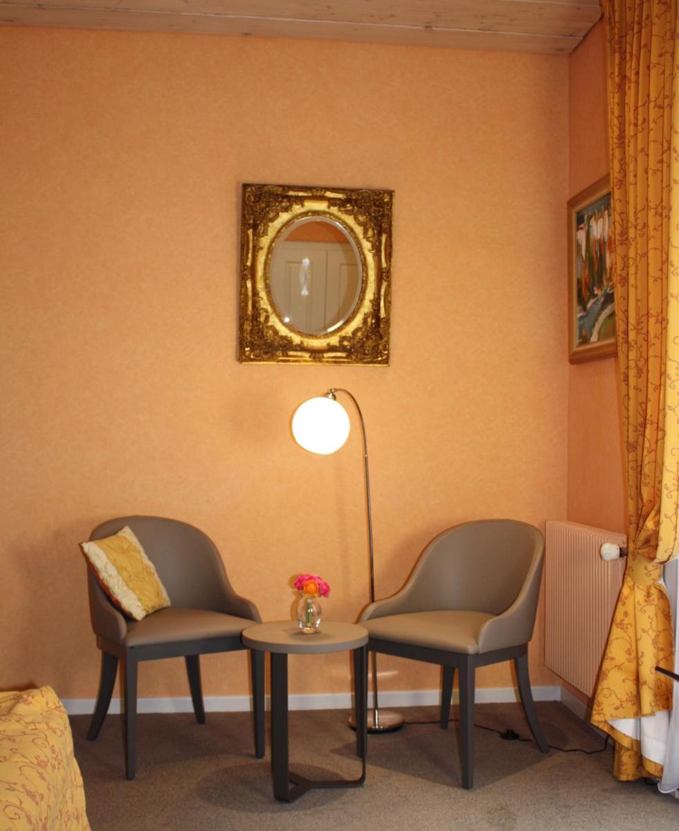 Coin salon dans l'établissement Hôtel Restaurant Taillard