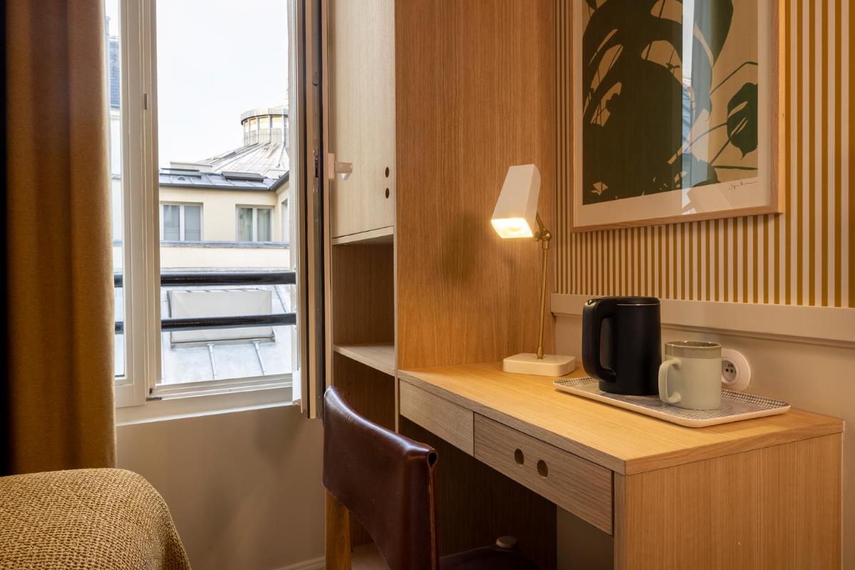 Cuisine ou kitchenette dans l'établissement Le Petit Oberkampf Hotel & Spa