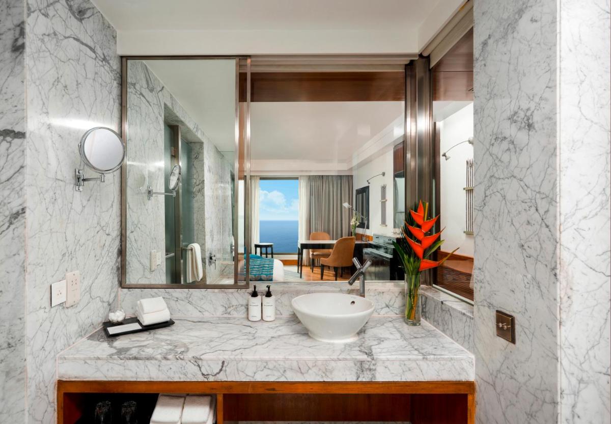 a bathroom with a sink and a mirror at InterContinental Marine Drive Mumbai by IHG in Mumbai