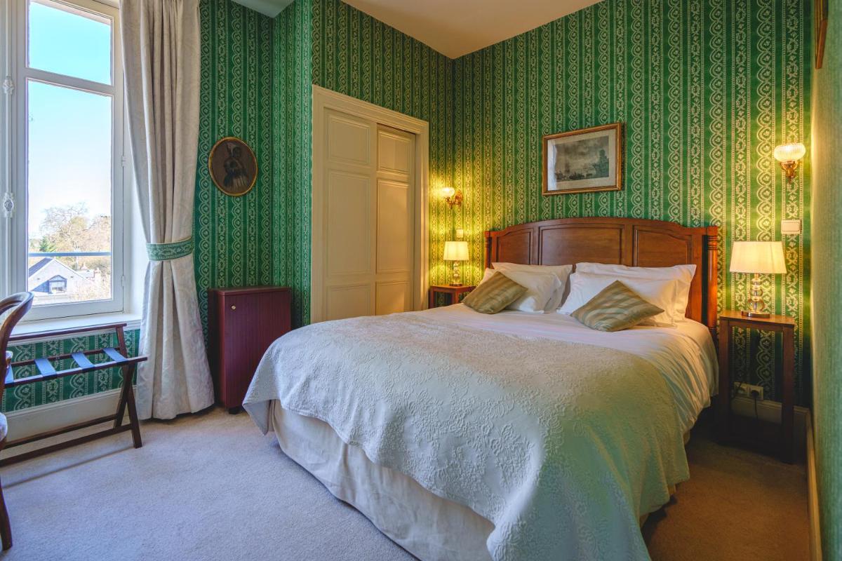 Un ou plusieurs lits dans un hébergement de l'établissement Château La Comtesse de Loire & Spa