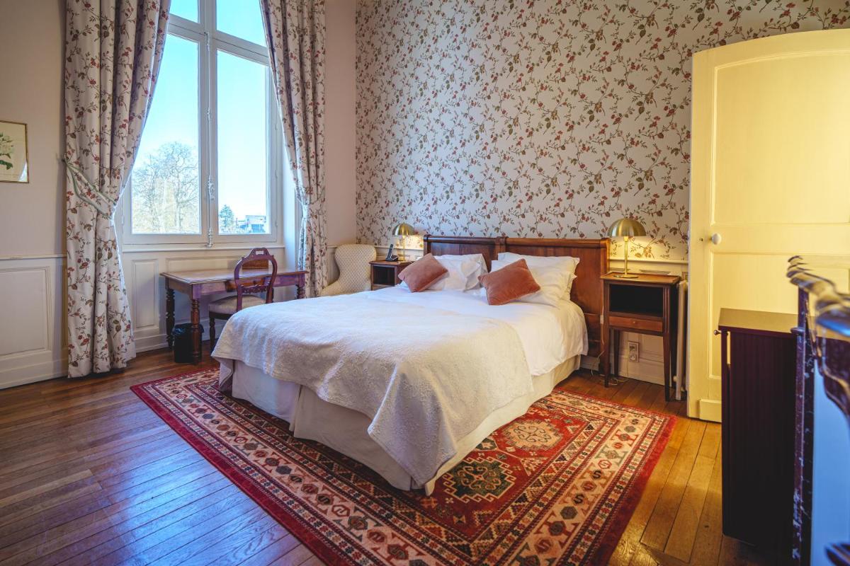 Un ou plusieurs lits dans un hébergement de l'établissement Château La Comtesse de Loire & Spa