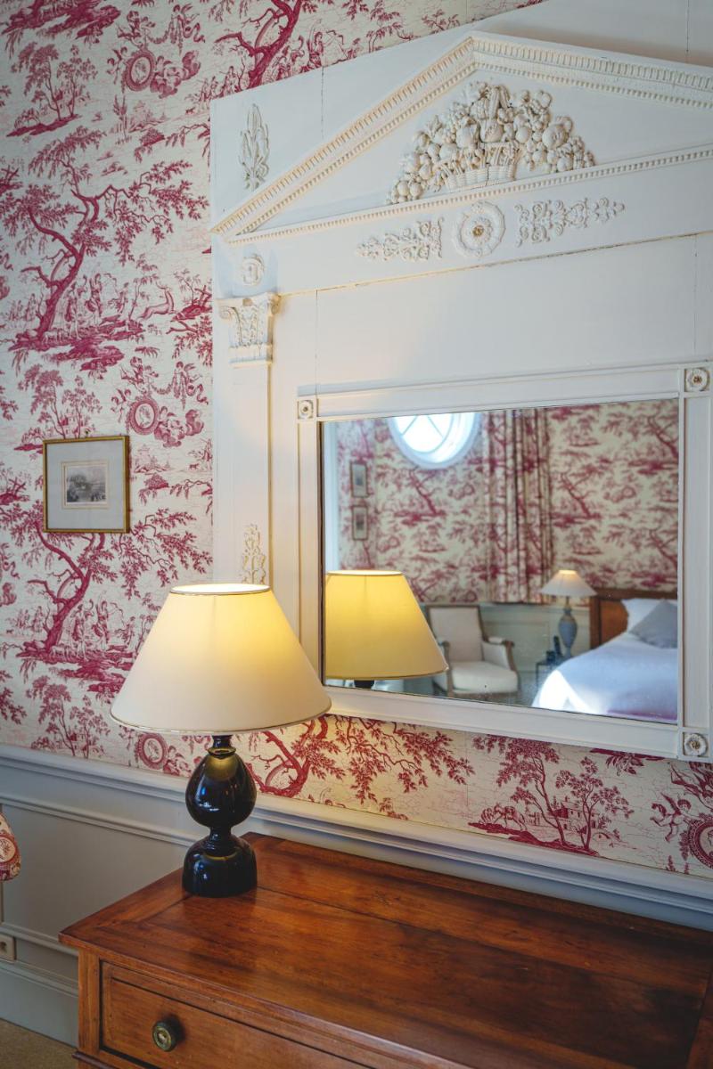 Un ou plusieurs lits dans un hébergement de l'établissement Château La Comtesse de Loire & Spa