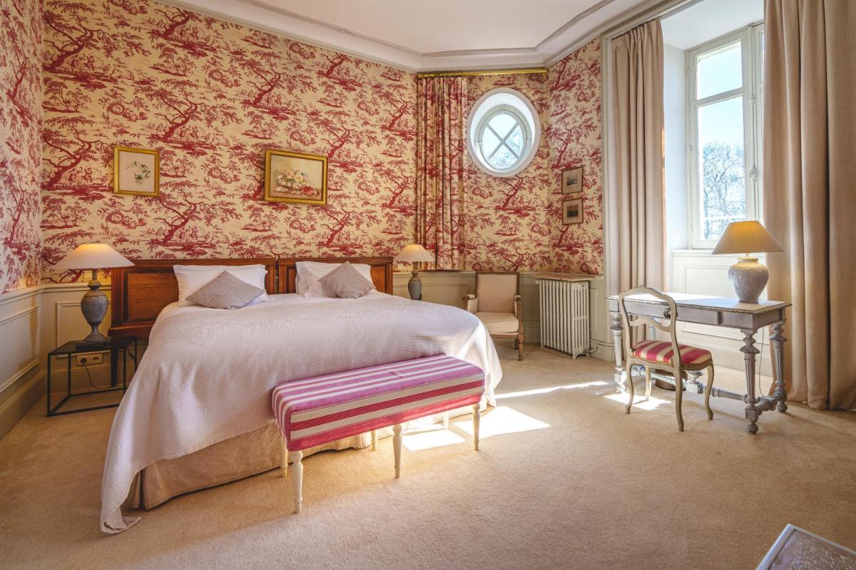 Un ou plusieurs lits dans un hébergement de l'établissement Château La Comtesse de Loire & Spa