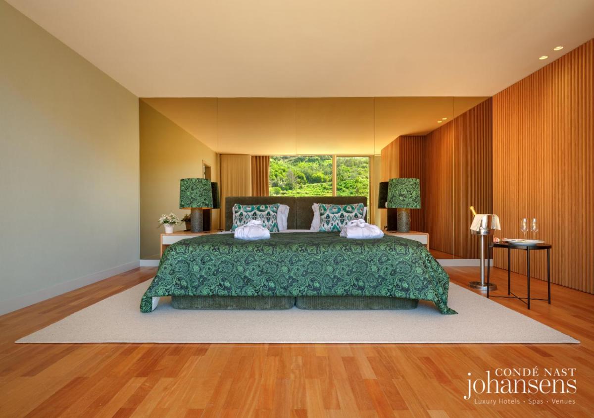 Uma cama ou camas num quarto em Pure Monchique Hotel - Villa Termal Spa Resort - by Unlock Hotels
