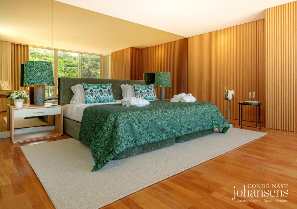 Uma cama ou camas num quarto em Pure Monchique Hotel - Villa Termal Spa Resort - by Unlock Hotels