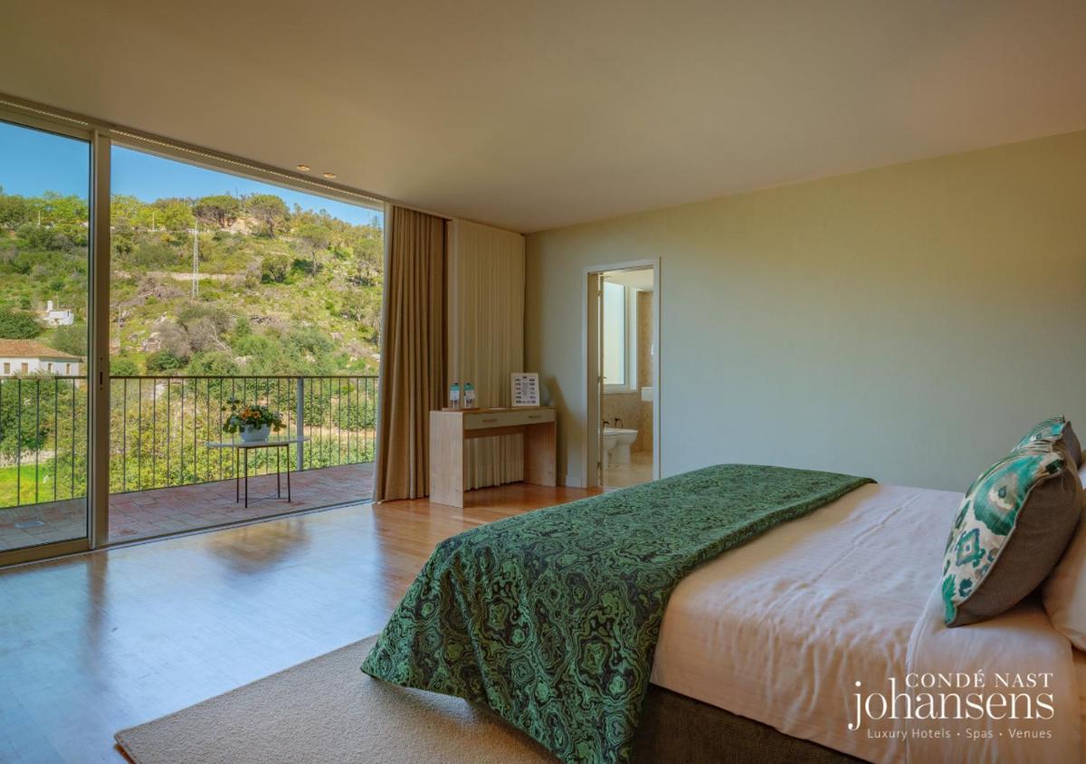 Uma cama ou camas num quarto em Pure Monchique Hotel - Villa Termal Spa Resort - by Unlock Hotels