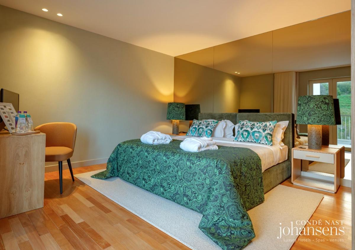 Uma cama ou camas num quarto em Pure Monchique Hotel - Villa Termal Spa Resort - by Unlock Hotels