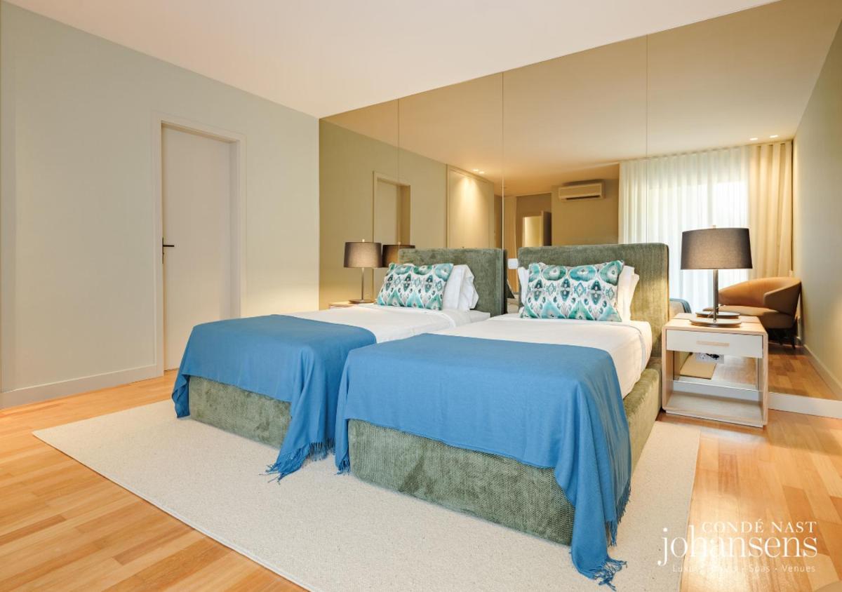 Uma cama ou camas num quarto em Pure Monchique Hotel - Villa Termal Spa Resort - by Unlock Hotels