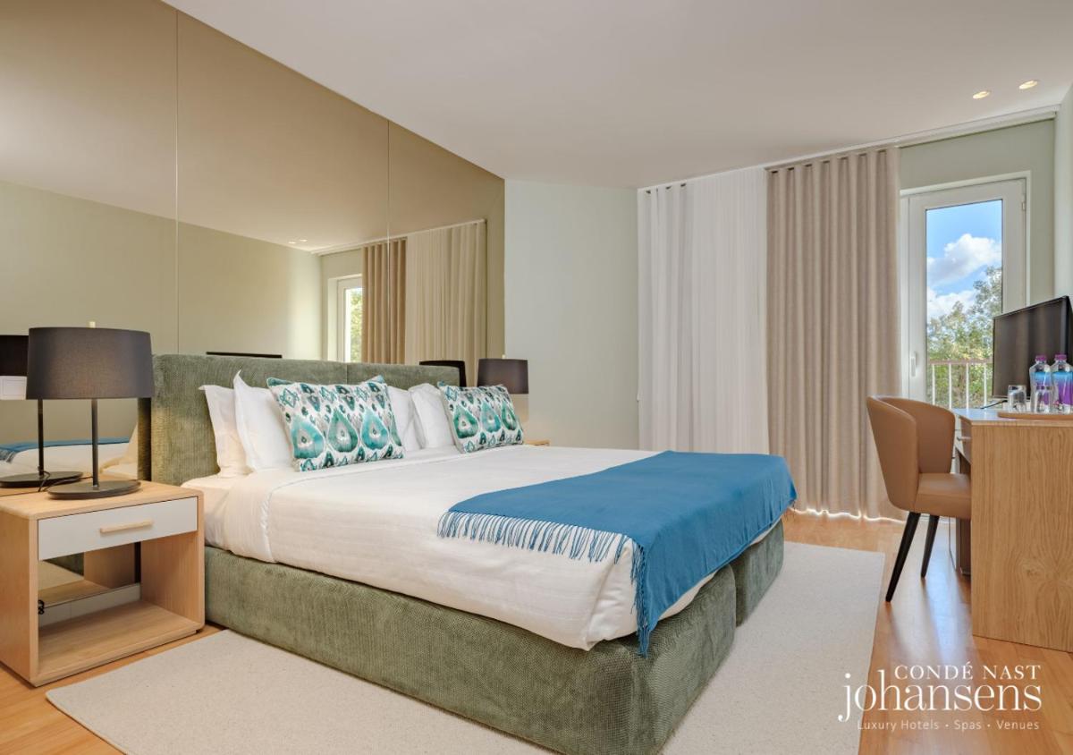 Uma cama ou camas num quarto em Pure Monchique Hotel - Villa Termal Spa Resort - by Unlock Hotels