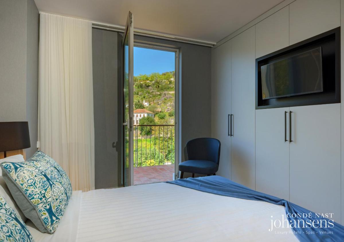 Uma cama ou camas num quarto em Pure Monchique Hotel - Villa Termal Spa Resort - by Unlock Hotels