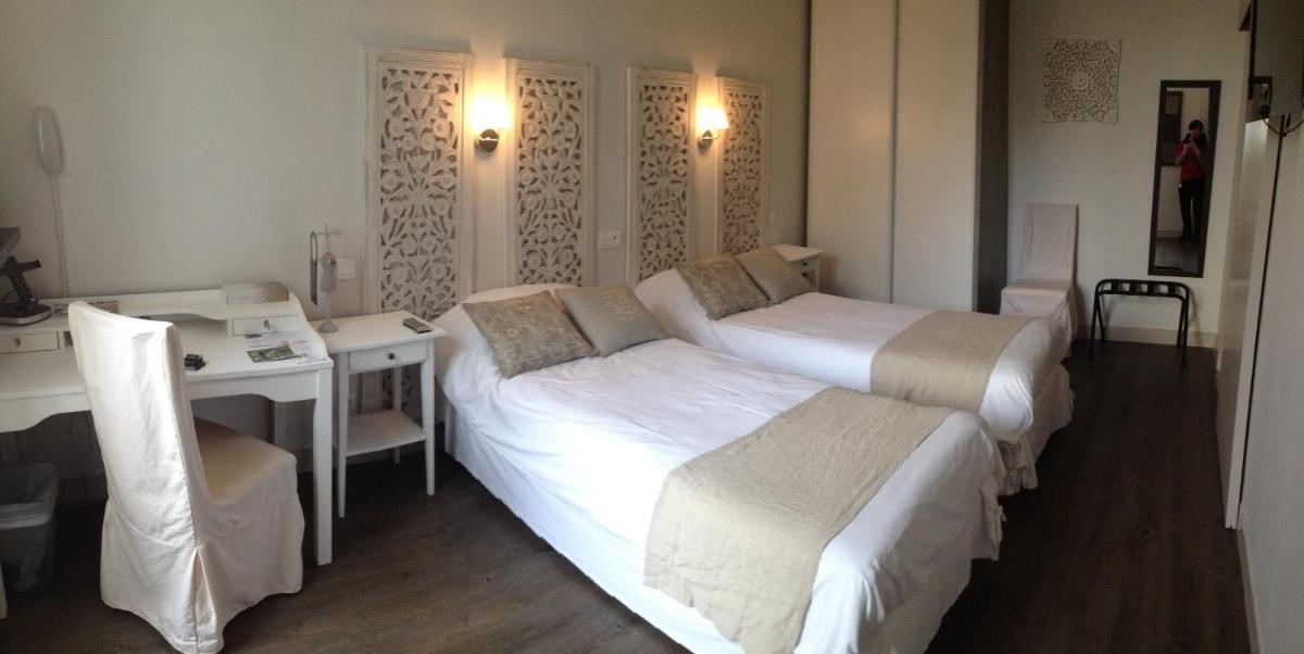 Un ou plusieurs lits dans un hébergement de l'établissement Grand Hôtel des Bains SPA