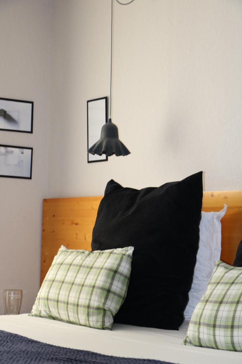 Un ou plusieurs lits dans un hébergement de l'établissement Hotel Spa Azteca Barcelonnette
