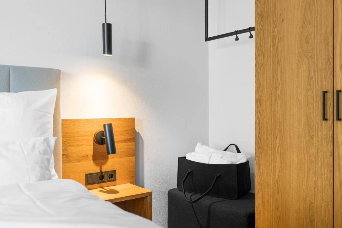 Ein Bett oder Betten in einem Zimmer der Unterkunft zeitlang by Rösslwirt