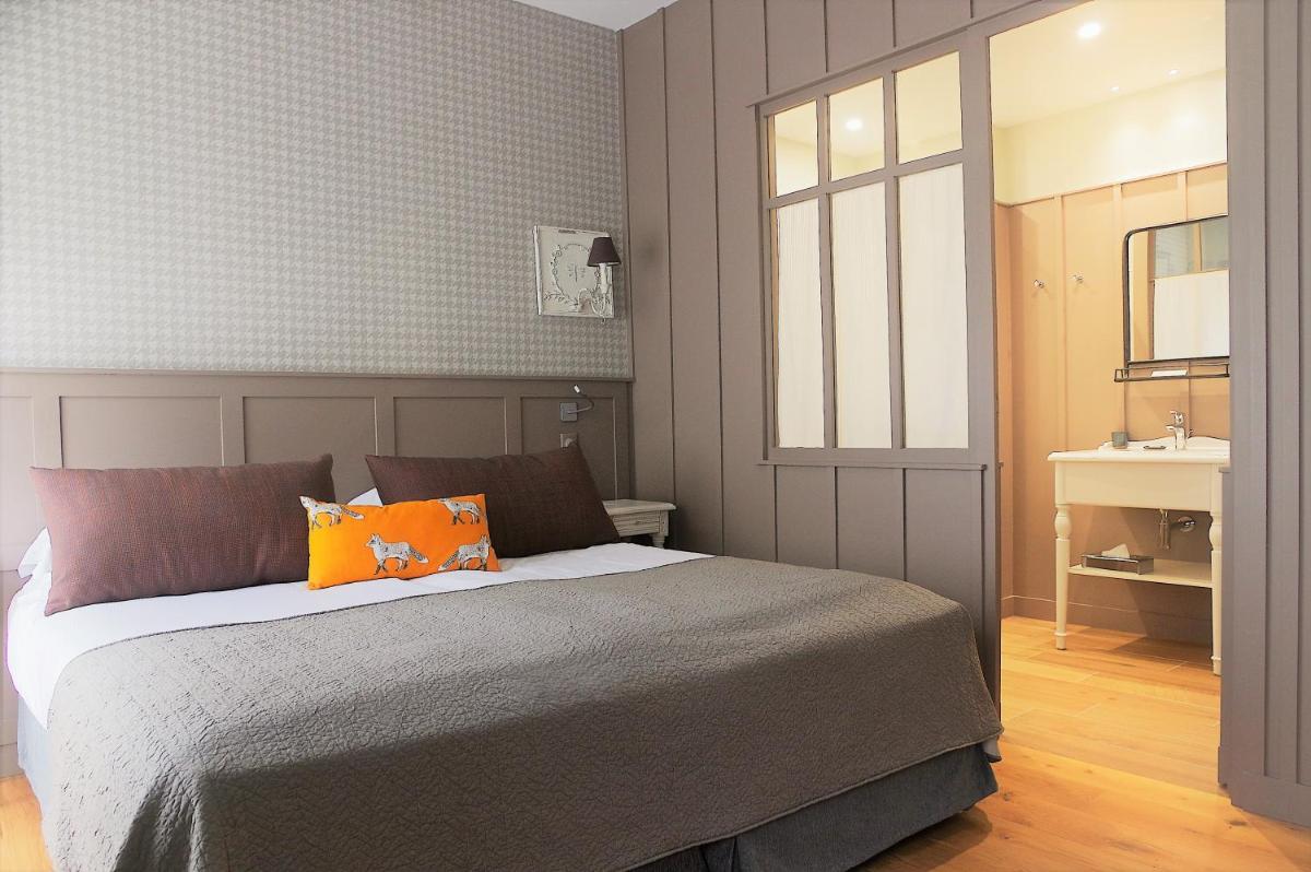 Un ou plusieurs lits dans un hébergement de l'établissement Les Glycines - Hôtel & Spa - Teritoria