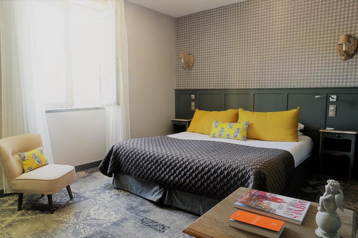 Un ou plusieurs lits dans un hébergement de l'établissement Les Glycines - Hôtel & Spa - Teritoria