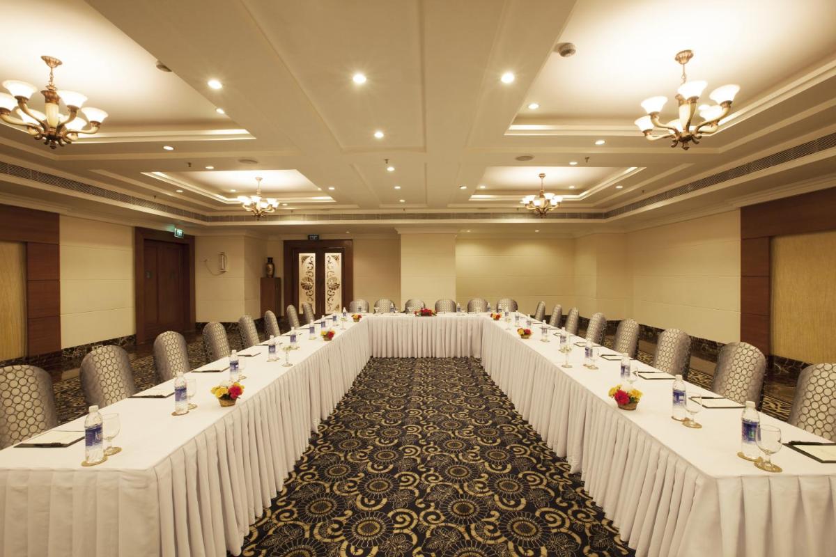 a large room with rows of tables and chairs at The Accord Metropolitan in Chennai