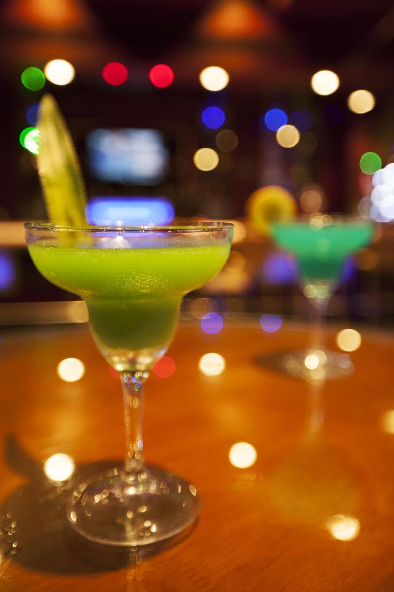 a green drink in a martini glass on a table at The Accord Metropolitan in Chennai