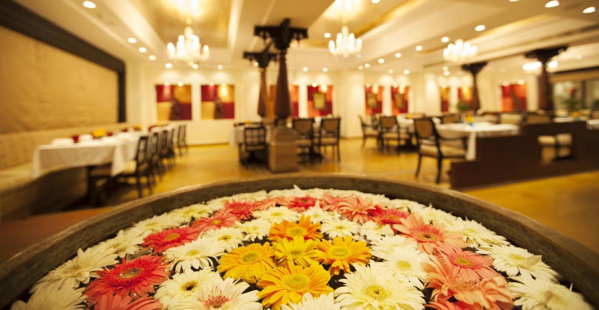 a large flower arrangement in the middle of a room at The Accord Metropolitan in Chennai