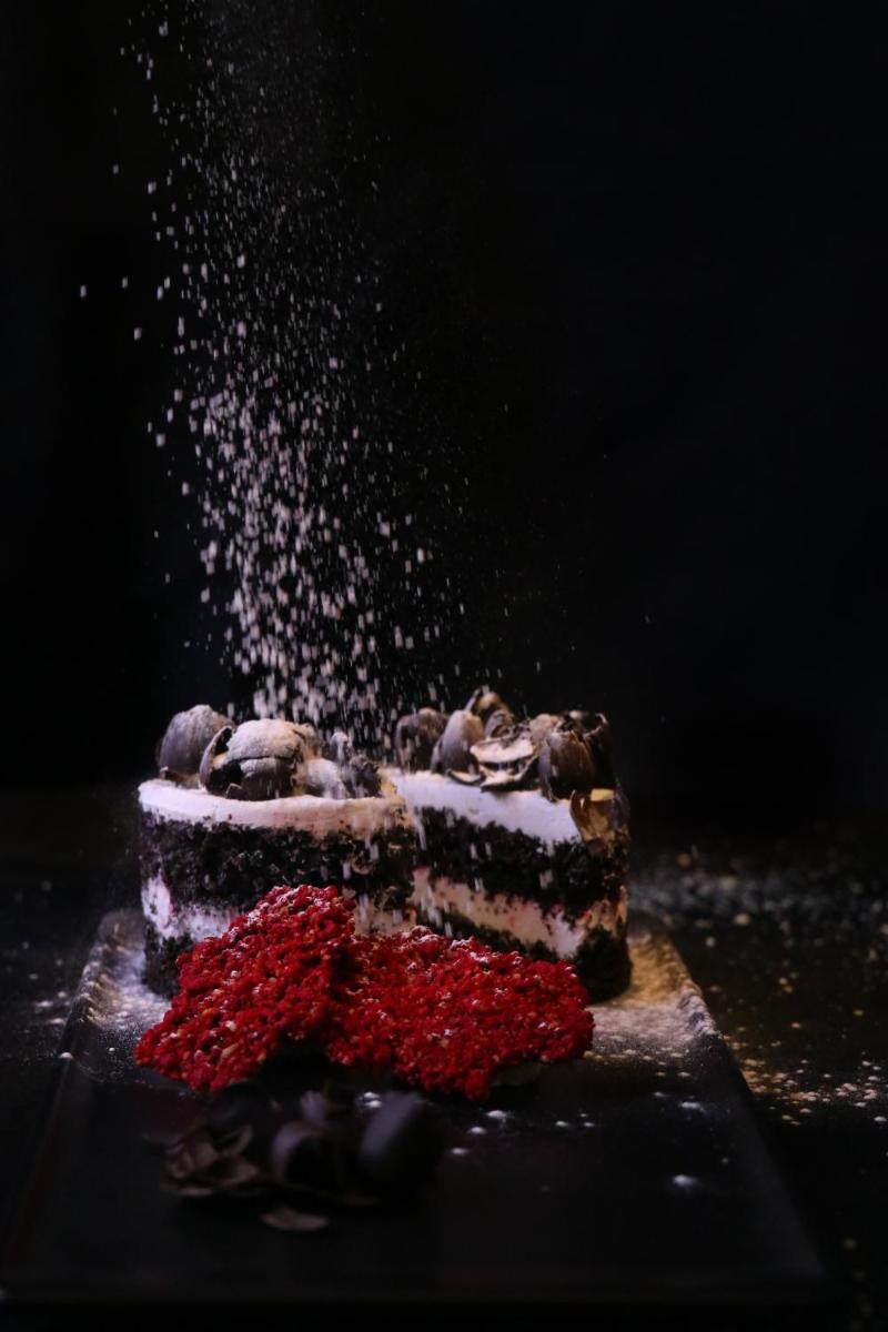 a piece of cake sitting on top of a table at Crowne Plaza Pune City Centre by IHG in Pune